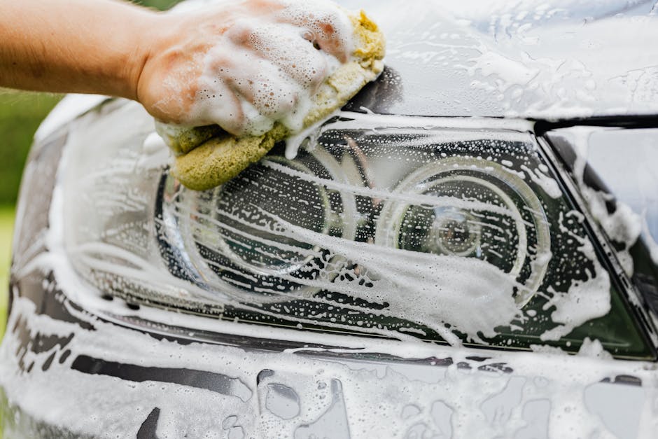 Thorough soapy car wash during auto detailing